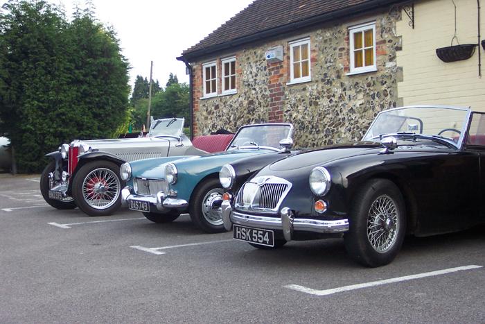 A typical cross section of cars that attend the Ashford &amp; Faversham club nights. A 1939 TB with two 1961 cars.
