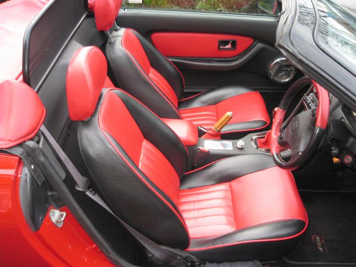 Interior reworked in red/black leather to match body colour