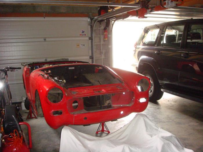 Midget stripped from of all it&#039;s components, to be replaced by a new body shell.